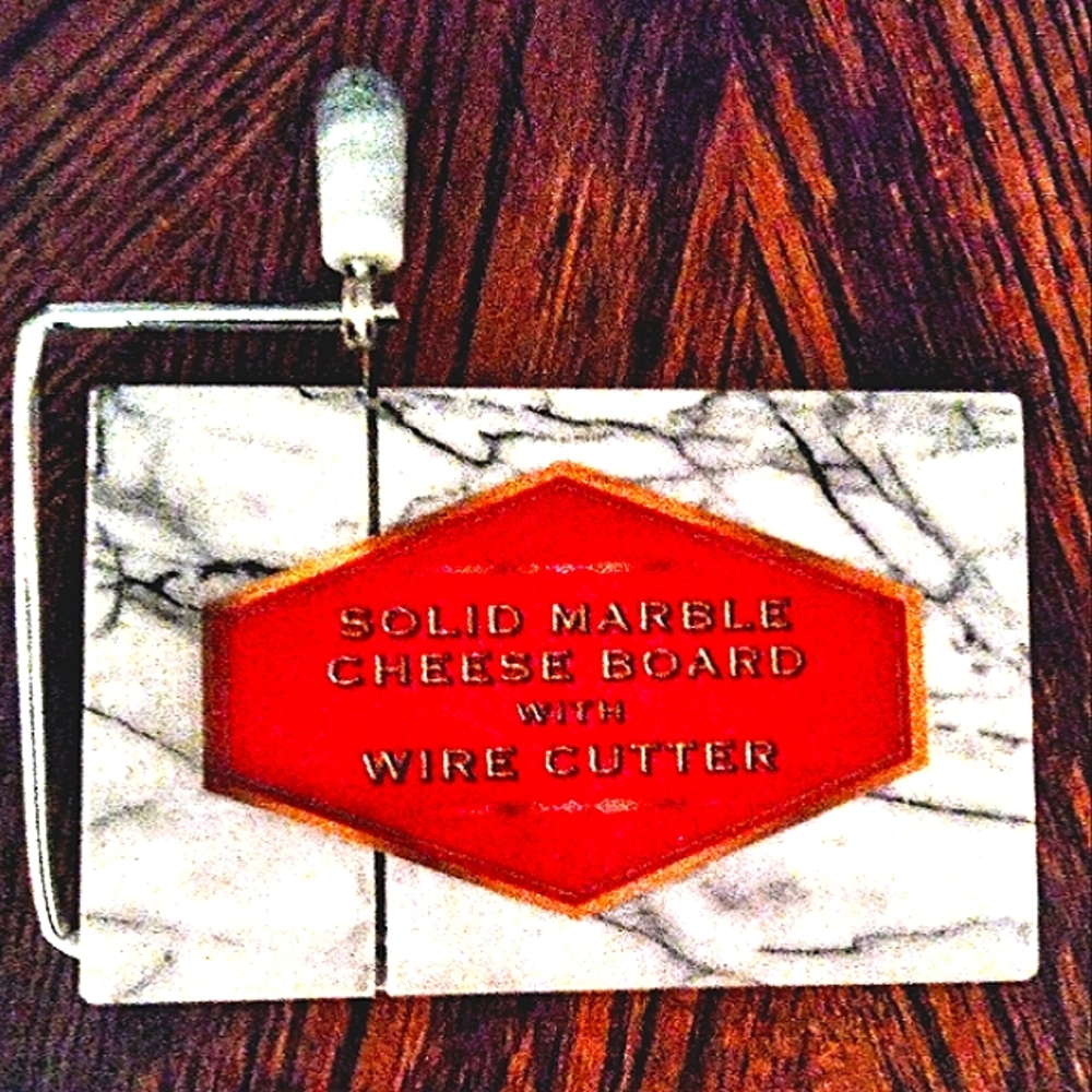 New marble cheese board with cutter.